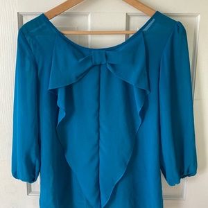 Sheer blouse with bow in back